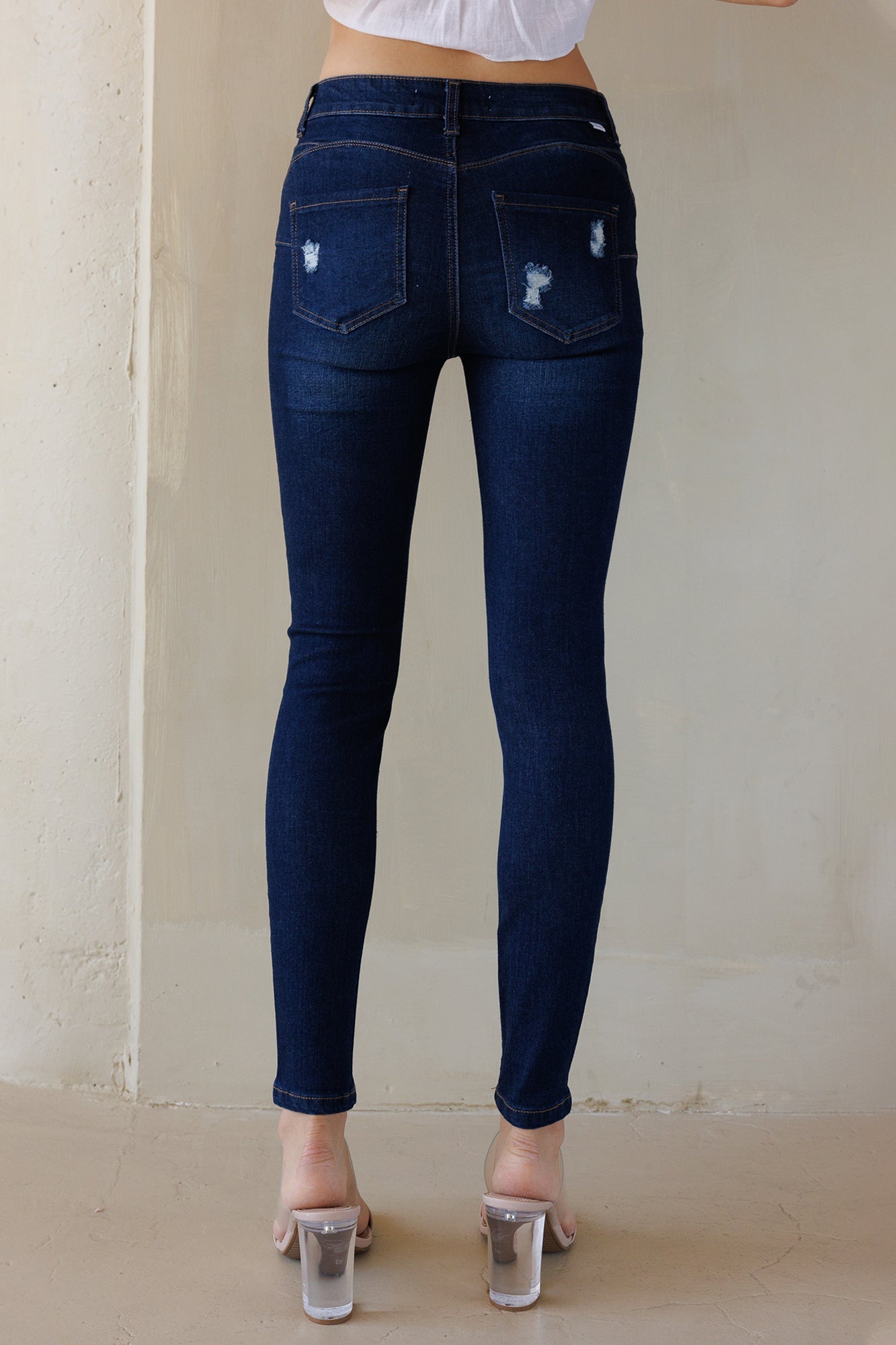 Mid Rise Destructed Skinny Jeans